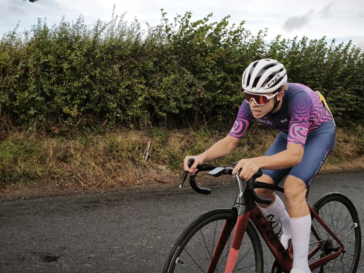 Cyclist riding along a quiet road